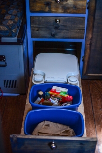 The waste drawer - trash, recycling, and portable toilet.